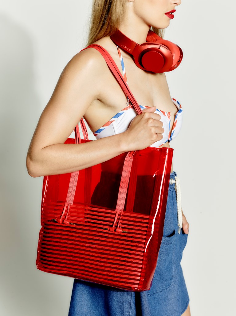 sony h.ear on red headphones with beach bag