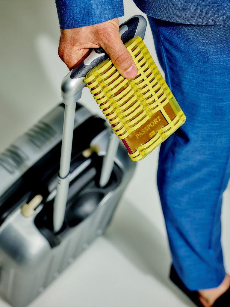 sony h.ear on yellow headphones with passport holder