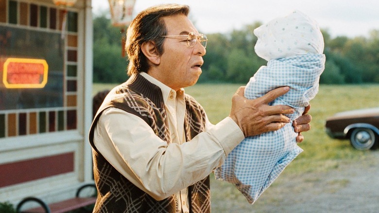 Eddie Murphy în machiaj și protetică ca un chinez în Norbit