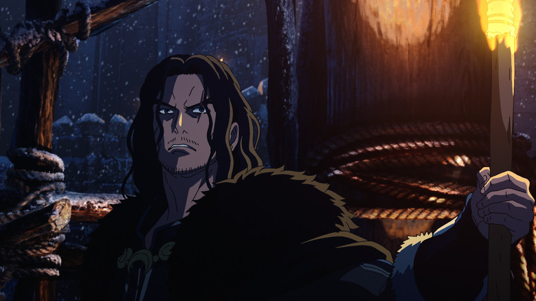 Luke Pasqualino ca Wulf ținând o torță în zăpadă în Stăpânul Inelelor: Războiul Rohirrim