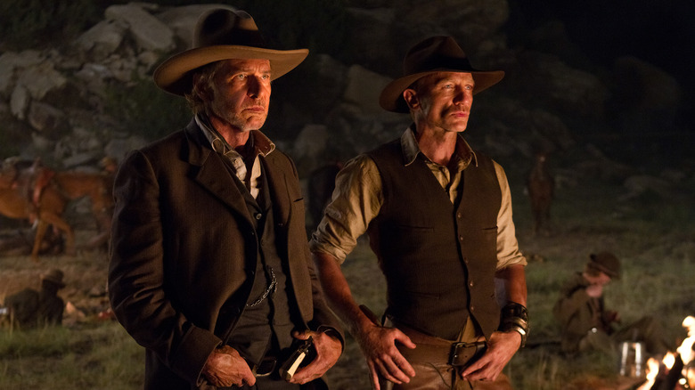 Harrison Ford ca colonelul Woodrow Dolarhyde și Daniel Craig ca Jake Lonergan în Cowboys & Aliens