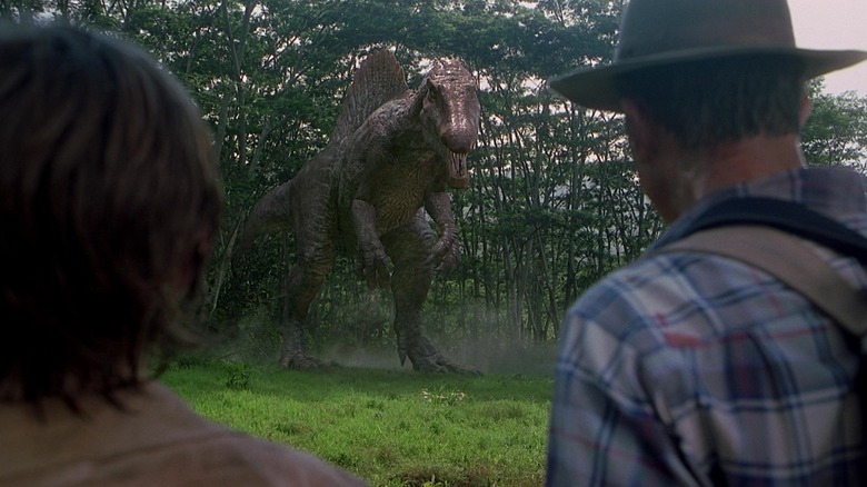 Dr. Grant și asociații săi se uită la un spinosaur din Jurassic Park 3