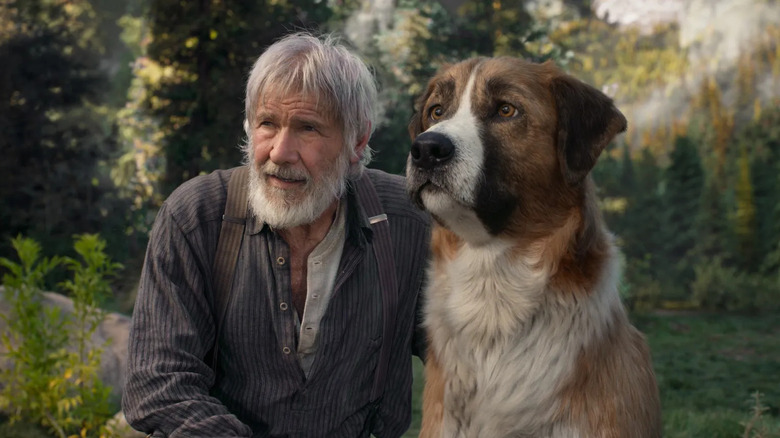 Harrison Ford ca John și Buck stând împreună în pustie în Call of the Wild