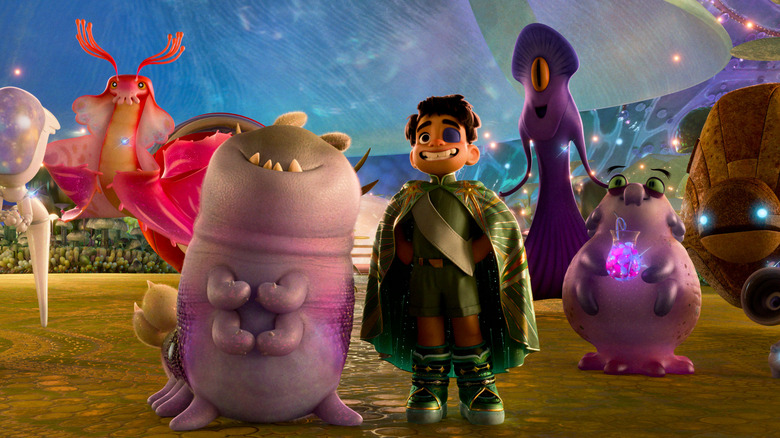 Yonas Kibreab ca vocea lui Elio stând lângă Aliens Glordon (Remy Edgerly), Tegman (Matthias Schweighöfer), Helix (Brandon Moon), Turais (Ana de la Reguera) și Questata (Jameela Jamil) în Elio în Elio