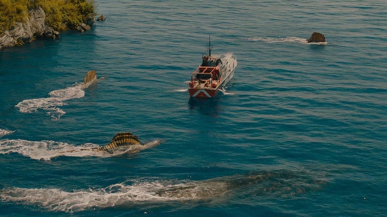 O barcă este vânată de un mosasaur și trei spinosaurus în renașterea mondială a jurassicului