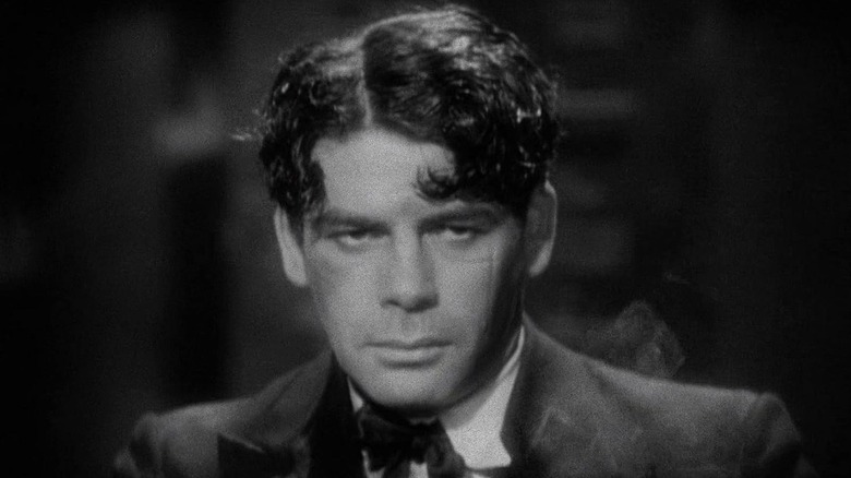 Paul Muni arătând plin de spirit ca Tony Camonte în Scarface (1932)