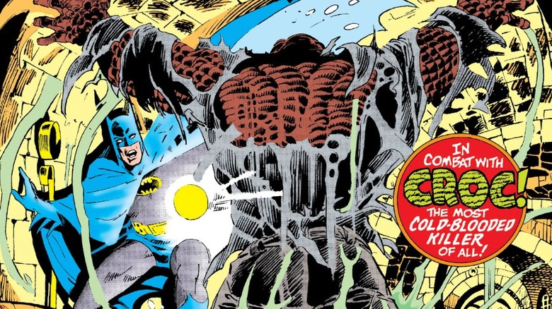 Coperta Detective Comics #525 - Batman în canalizare, ținând lanternă, în timp ce Killer Croc sare în fața lui