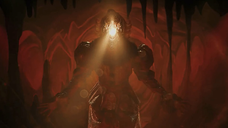 Pennywise al lui Bill Skarsgård se ridică de pe podea în timp ce dezvăluie Deadlights în It Welcome to Derry