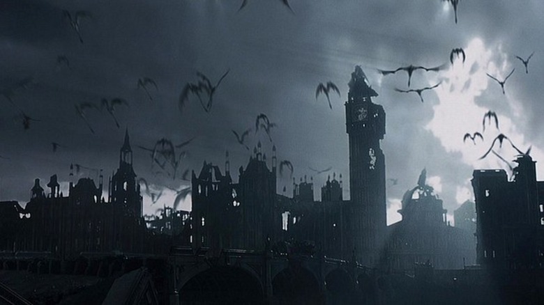 Un stol de dragoni care zboară deasupra unui castel în Reign of Fire