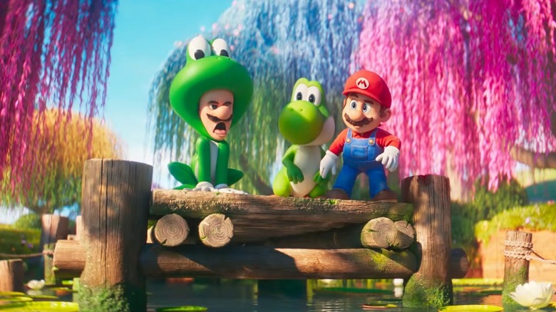 Luigi într-un costum de broască alături de Yoshi și Mario în filmul Super Mario Galaxy