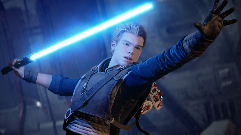 Cal Kestis cu sabia sa laser albastră într-o mână în Star Wars Jedi: Fallen Order