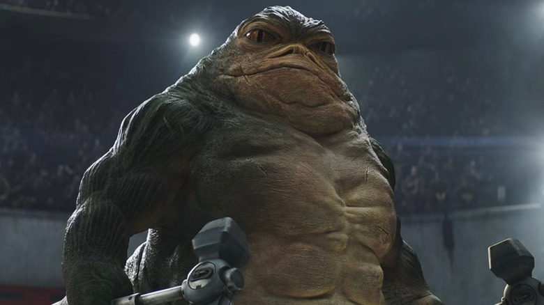 Rotta Hutt-ul ținând topoare într-o arenă de luptă din The Mandalorian și Grogu