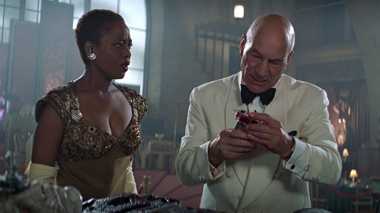 Lily și Picard, în articole formale din anii 1930, părând îngrijorați în Star Trek: First Contact