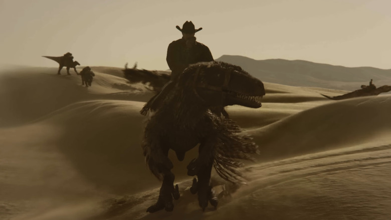 Un cowboy călare pe un răpitor în Dinosaurii din Vestul Sălbatic