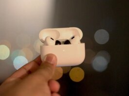 Close-up of memory foam ear tips fitted onto a pair of wireless earbuds