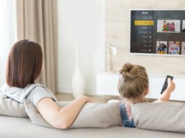 Plex app interface displayed on a smart TV screen in a living room