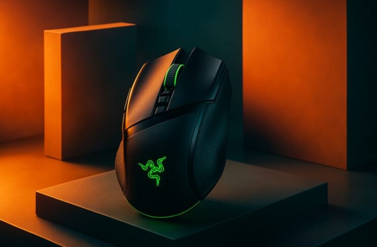 Razer Basilisk V4 Pro gaming mouse shown beside its Mouse Dock V2 Pro charging dock